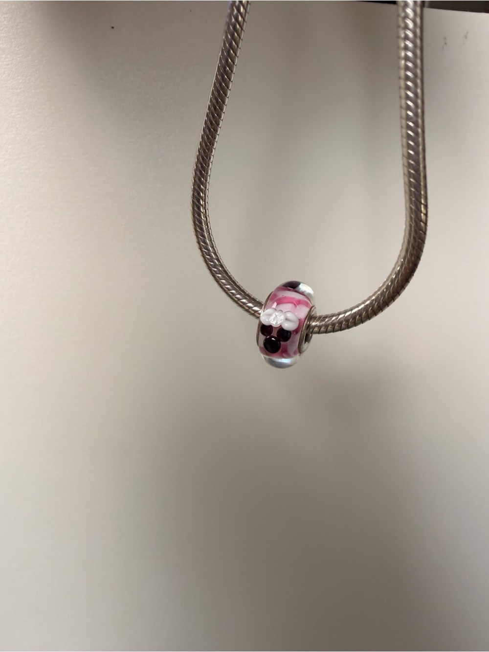 Pandora Minnie Mouse Murano Glass Bead Charm on Sterling Silver.